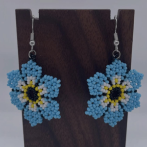 Blue flower with a white and yellow inside