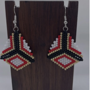 The beaded white, red, black and gold earrings