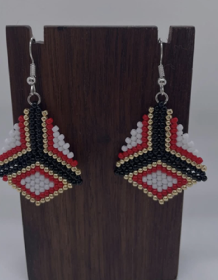 The beaded white, red, black and gold earrings